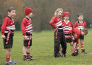 Leeston Ripper Rugby players waiting for the attack of the other team and the girl player is not having a good hair day.